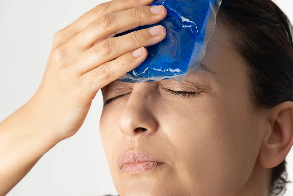 woman applies cold compress for excessive sweating