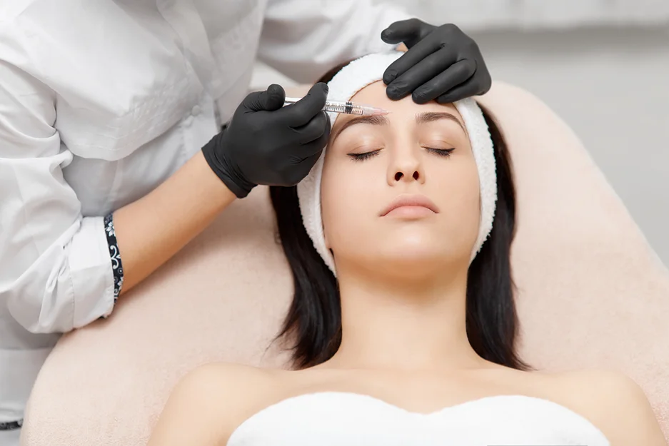 woman has botox injection in the forehead for hyperhidrosis